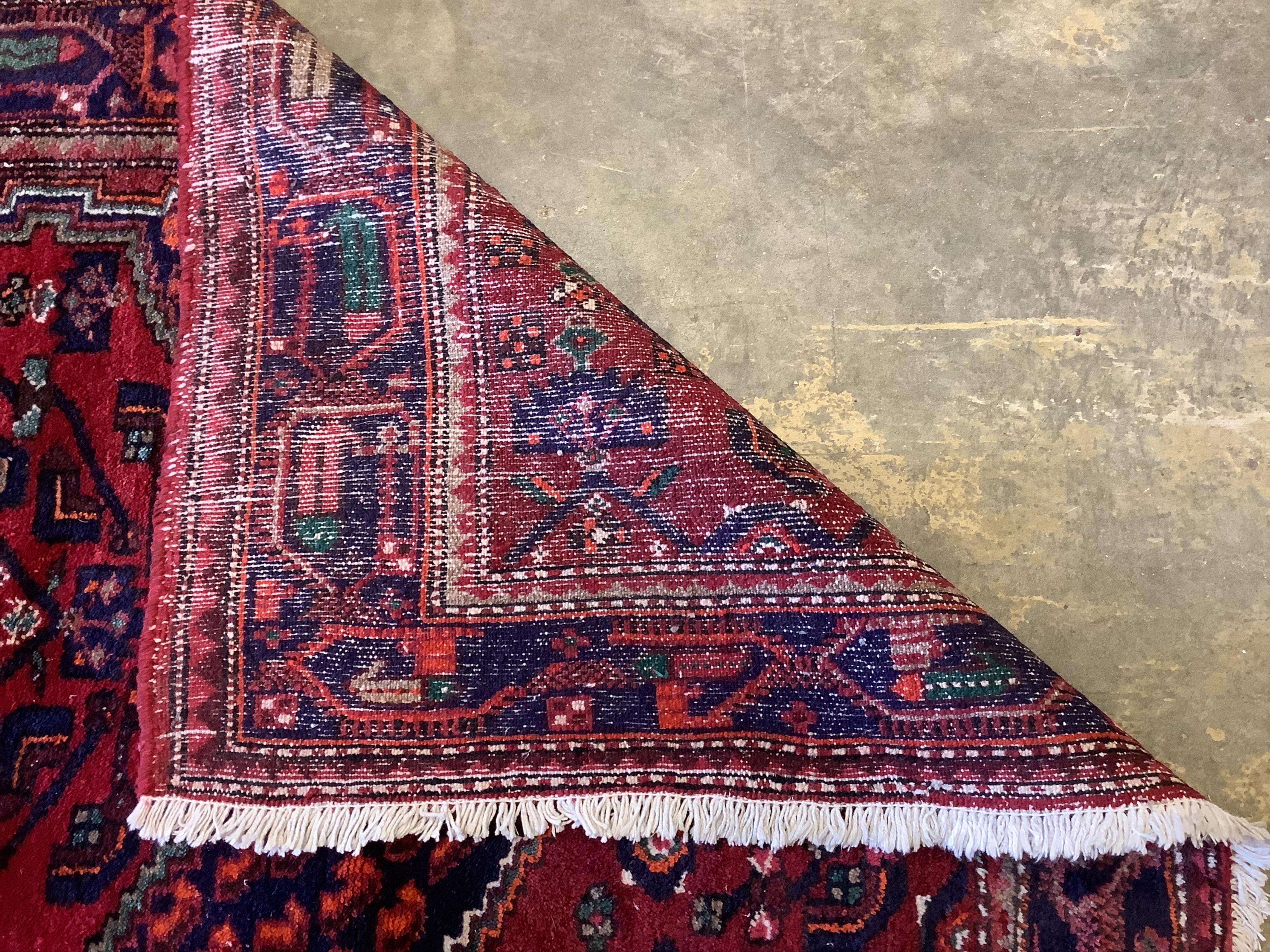 Three assorted Persian rugs, largest 190 x 128cm. Condition - fair